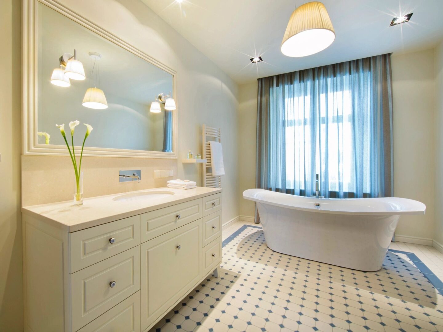 Elegant bathroom with a freestanding tub and double vanity.